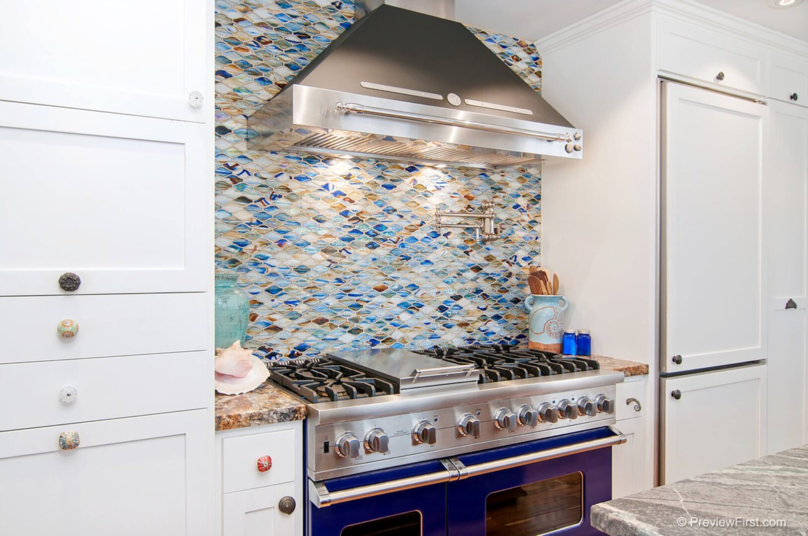 A kitchen with a stove and a blue oven.